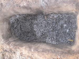 Charcoal in pit after burning.