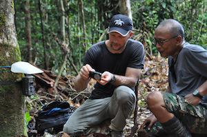 Checking camera traps.©Integrated Conservation.