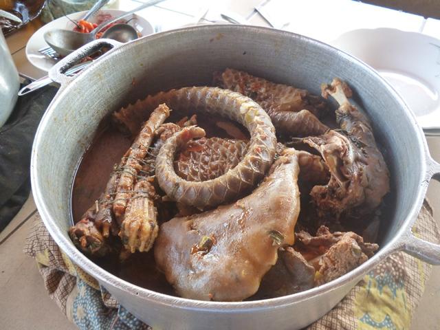 Pangolin meat in stew available in the eating area at the Ayos bus station.