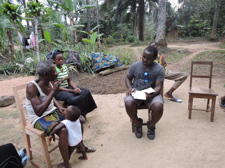 Mbunya Francis Nkemnyi interviewing a community leader in Banti village, Cameroon.