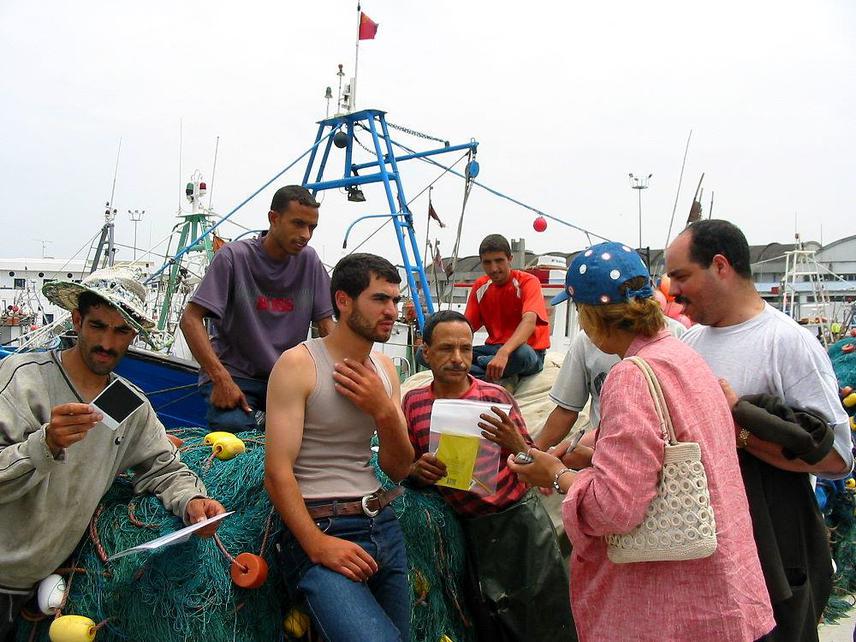 Informal interviews being conducted with fishermen in  Tangiers port in 2003.