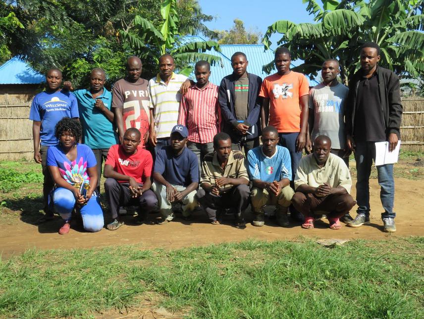 A picture of the project member with key informants at Mgambazi village during data collection.