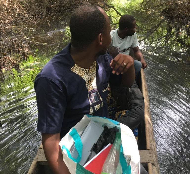 Dr. Pelebe Edéya Orobiyi Rodrigue and his colleague Koussovi Guillaume in a canoe on Benin coastal lagoon looking for fishermen in operation.