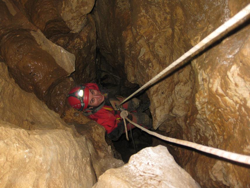 Eter Maghardze is preparing to go down a vertical cave to collect invertebrates. © Lado Shavadze.