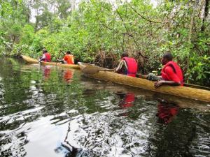 Rural community join survey Team mapping manatee spots on the Maffa River.