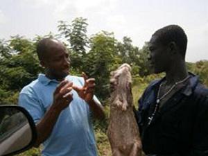 Eric interviewing a bushmeat seller on a commercial drivers’ route during the scoping activity