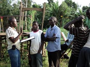 Patrick meeting with car washers during field interview, part of baseline survey, to establish knowledge on wetlands.