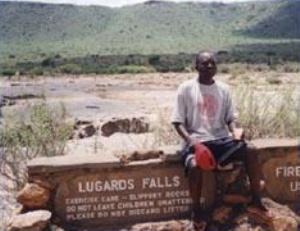 Dalmas Oyugi at Lugard's Falls. In the background is the Yatta Plateau.