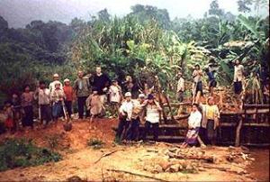 James Hardcastle with local people in the Vietnamese jungle.