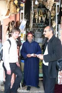 Marrakech market survey: A vendor in the spice market with (l) Hugo de Boer of Uppsala University and Mohamed El Haouzi, GDF-Maroc project coordinator.